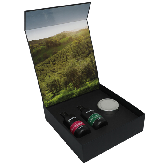 Premium Pasolivo products packaged in beautiful black box with green olive orchard imagery.