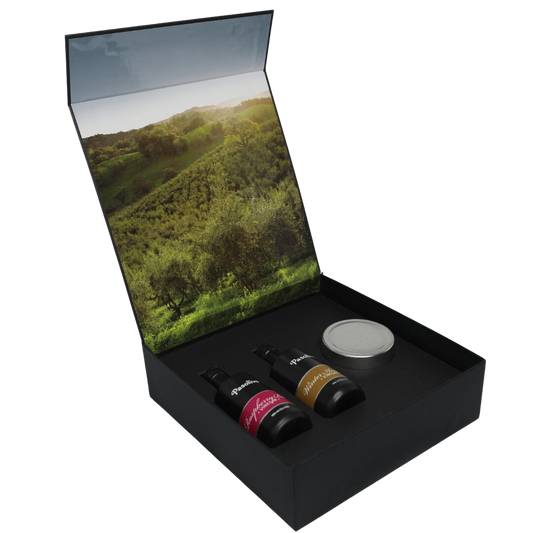 Premium Pasolivo products packaged in beautiful black box with green olive orchard imagery.