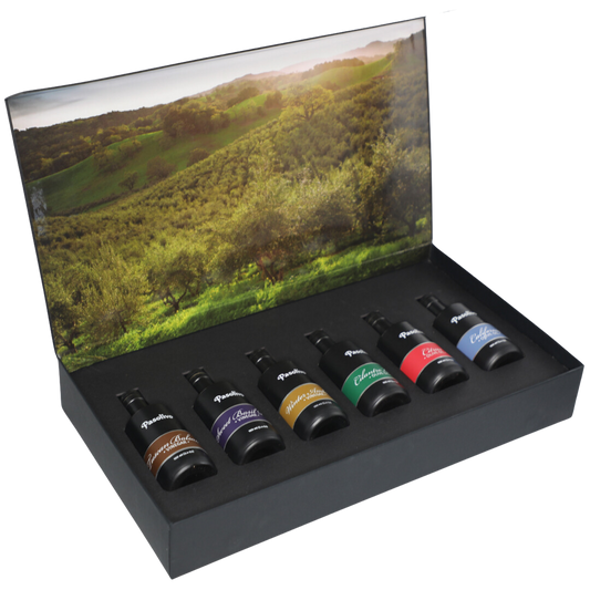 Premium Pasolivo products packaged in beautiful black box with green olive orchard imagery.