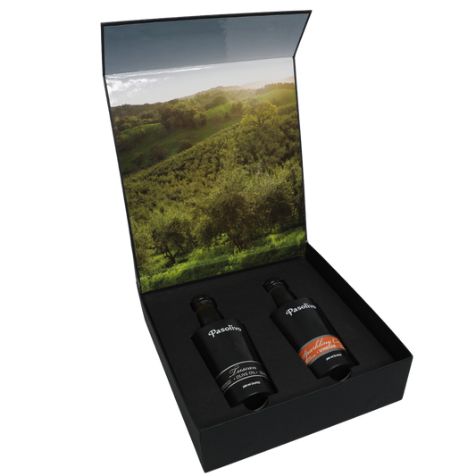 Premium Pasolivo products packaged in beautiful black box with green olive orchard imagery.