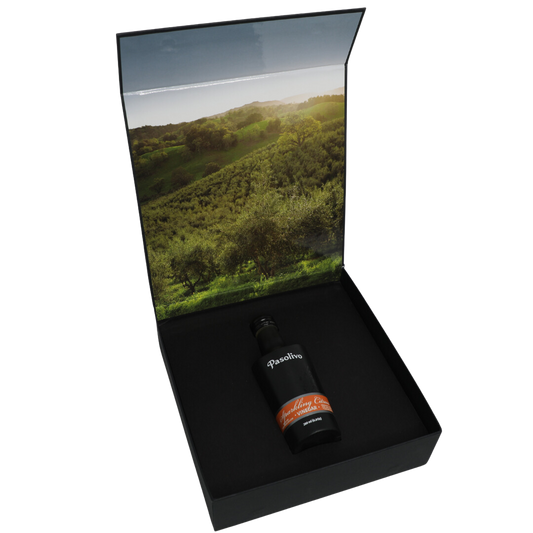 Premium Pasolivo products packaged in beautiful black box with green olive orchard imagery.