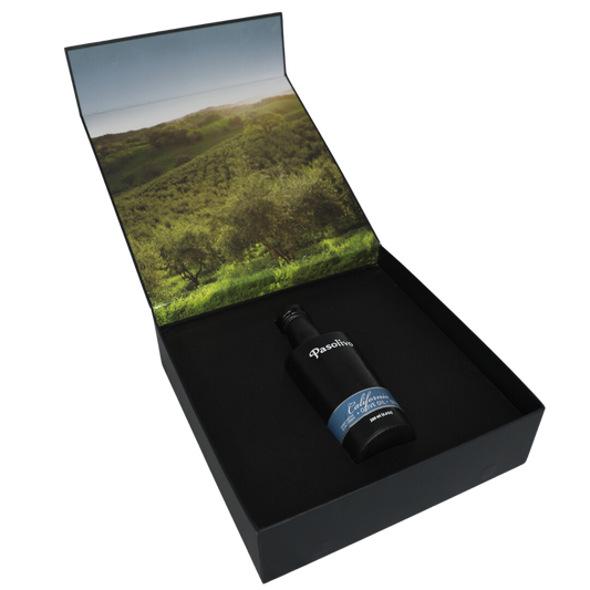 Premium Pasolivo products packaged in beautiful black box with green olive orchard imagery.