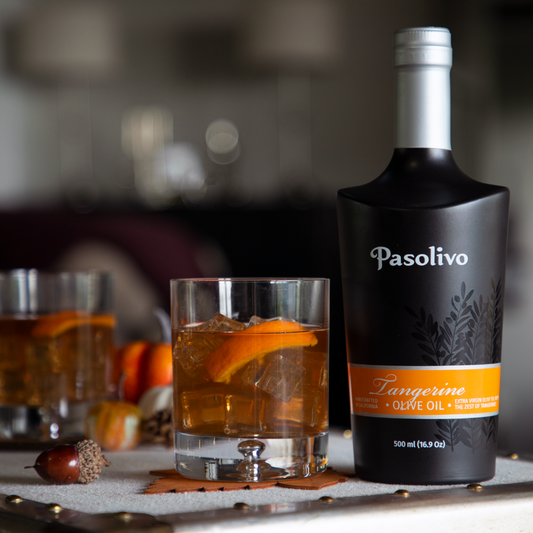 Pasolivo Tangerine Old Fashioned Recipe on a table next to Pasolivo Tangerine Olive Oil