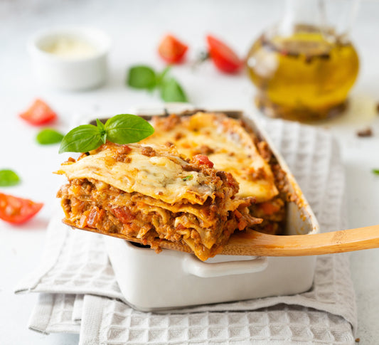 Pasolivo Lasagna Recipe cut with a wooden spoon