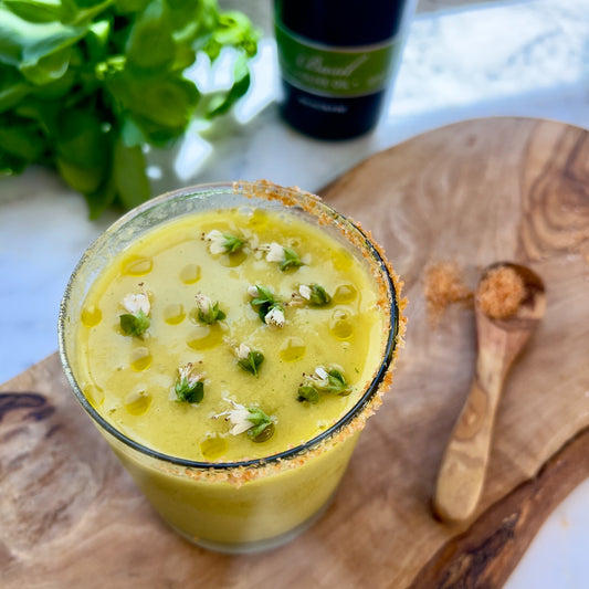 Pasolivo Basil Mango Daquiri Recipe on countertop next to a spoonful of Pasolivo Sriracha Salt