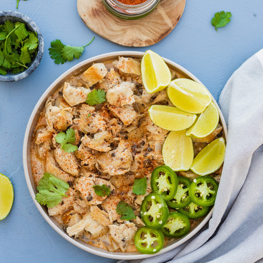 Pasolivo Cilantro Lime Chicken Recipe garnished with limes and peppers