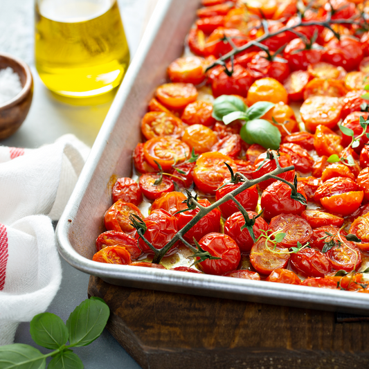 Pasolivo Roasted Tomatoes with Basil Oil Recipe on a table with pasolivo olive oil, salt, and a towel